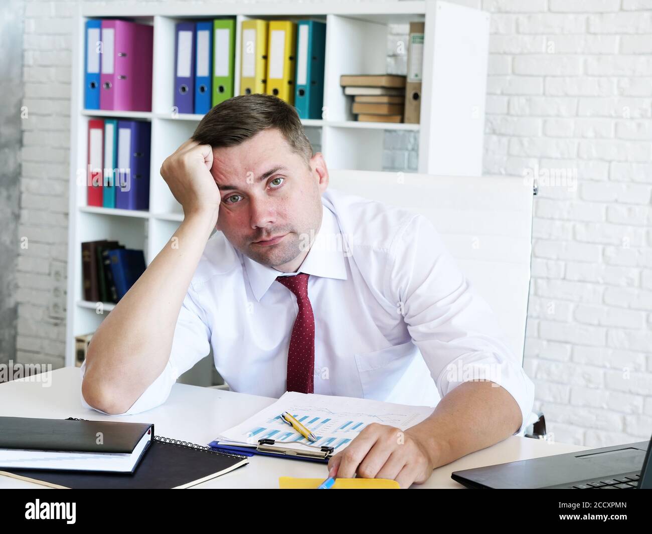 Bankruptcy and business problems. Portrait of a tired businessman. Stock Photo