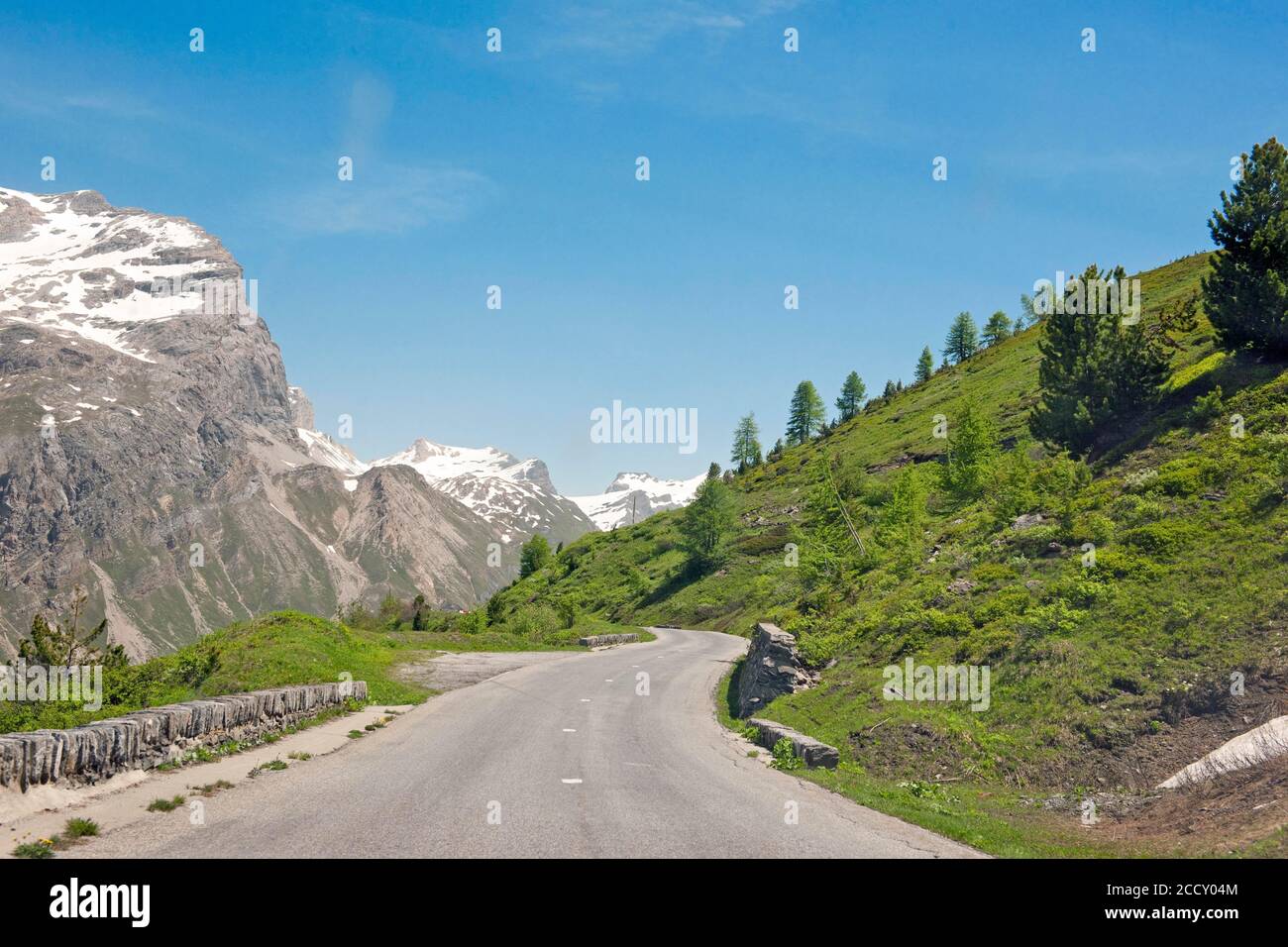 Remote alpine road, tree line, high alps, Piedmont, Italy Stock Photo