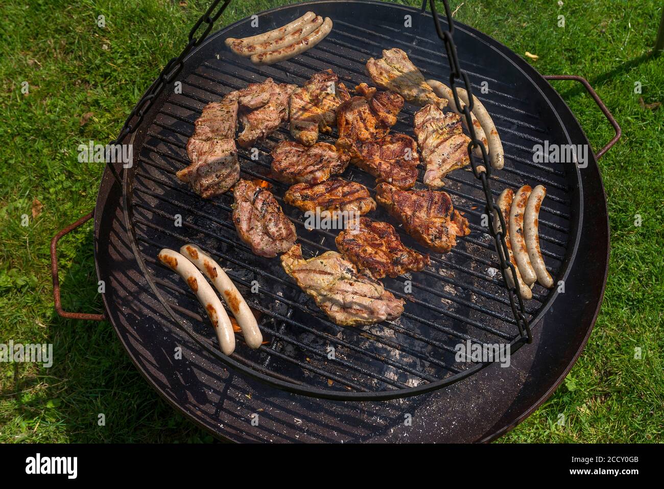 Finished barbecue on a swivel grill, Mecklenburg-Western Pomerania, Germany Stock Photo