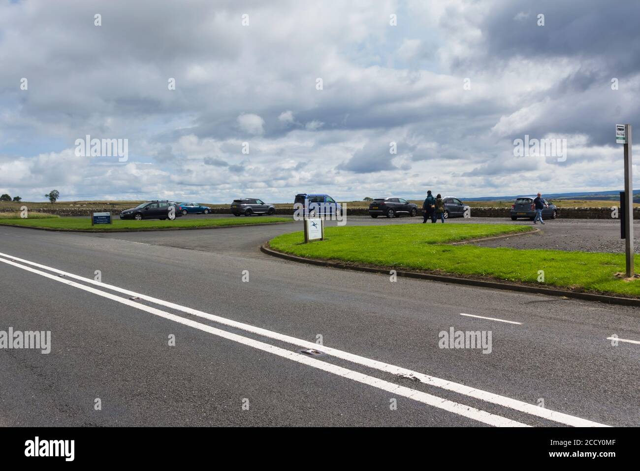 Brocolitia car park on the B6318 (known locally as 'the military road') adjacent to Hadrian's Wall and the site of the Roman Temple of Mithras. Stock Photo
