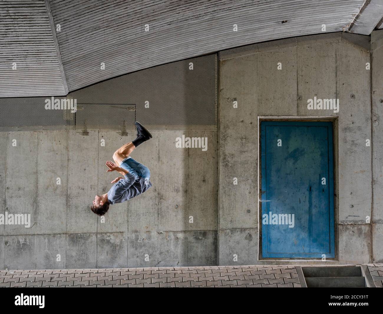 Teenager, 19 years, backflip, under bridge, Germany Stock Photo Alamy