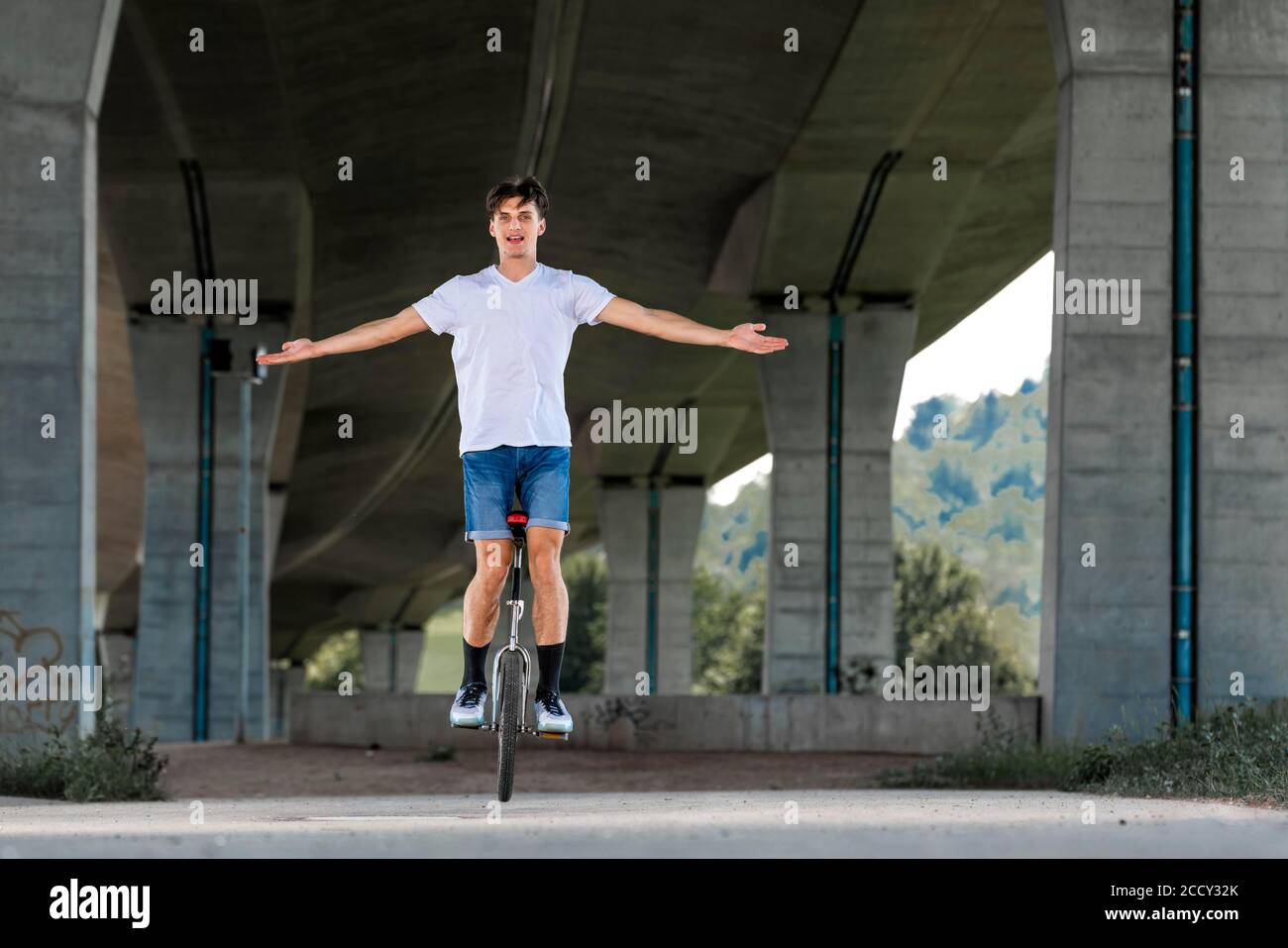 Teenager, 19 years old, rides a unicycle, Germany Stock Photo Alamy