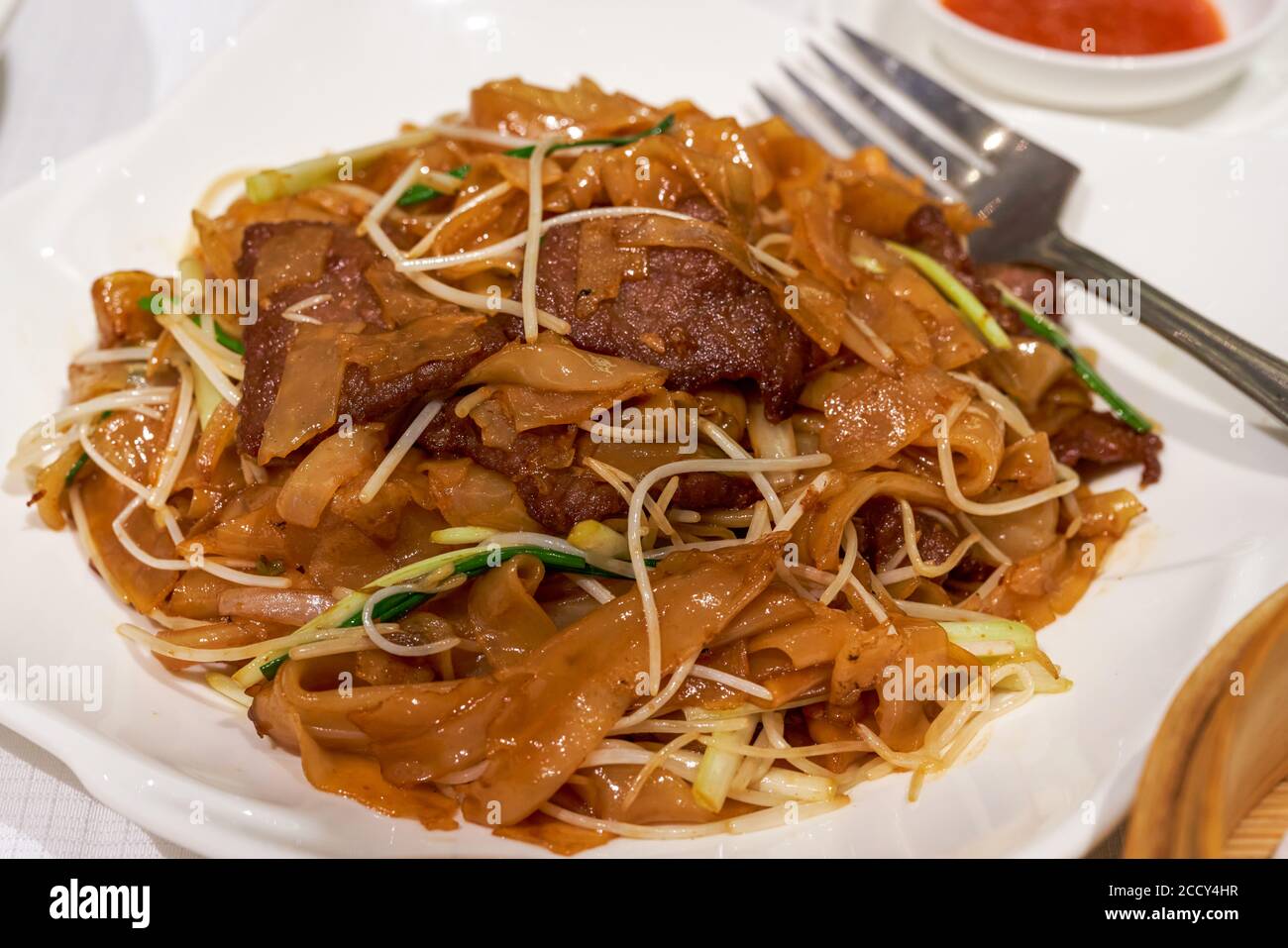 A delicious classic Cantonese dish, fried beef rice noodles Stock Photo
