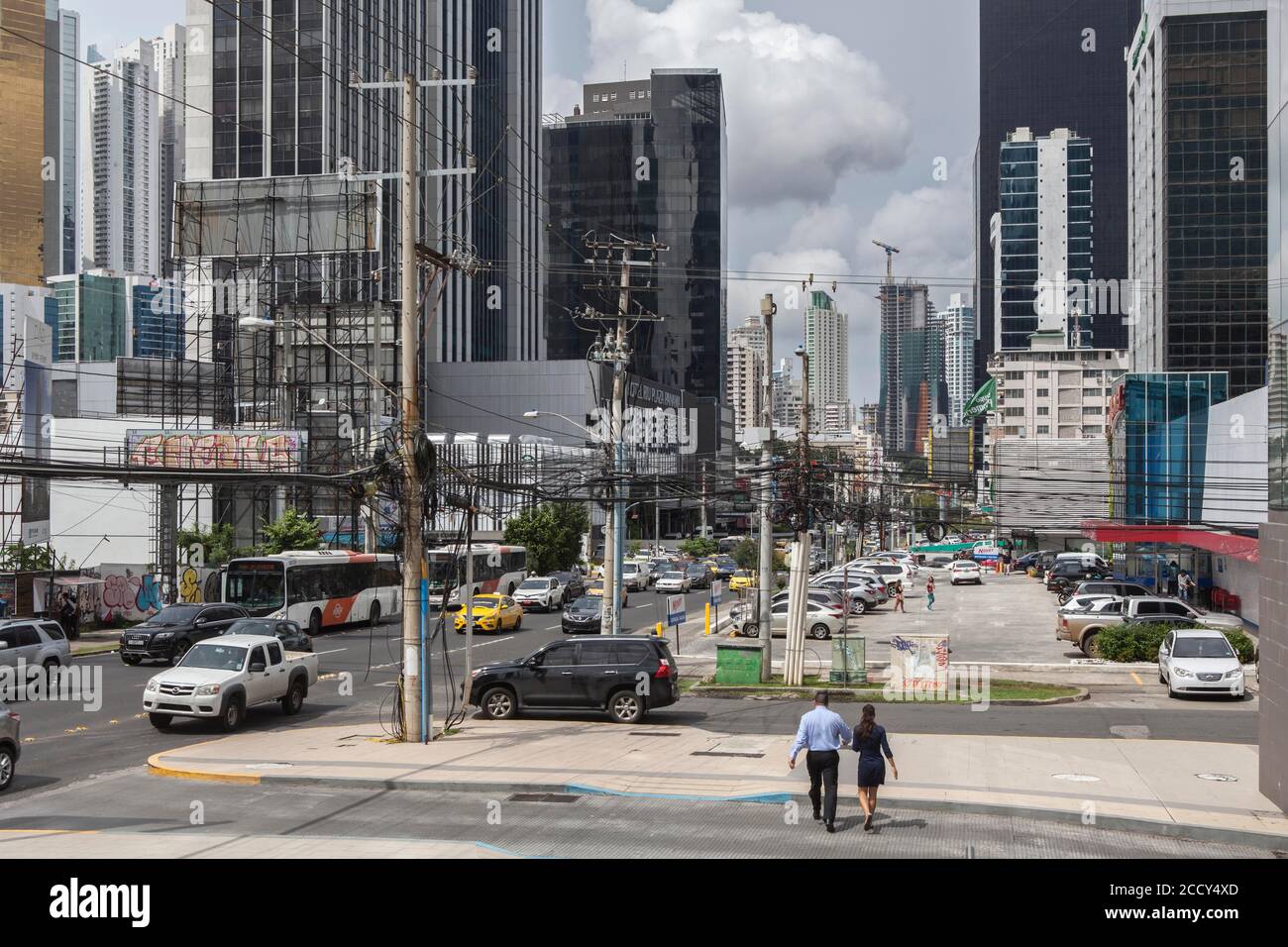 Bank employees crossing the street in the financial district, Panama City, Panama Stock Photo