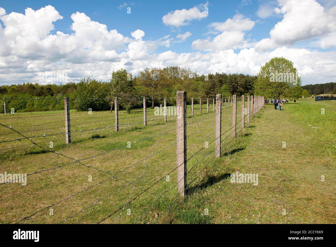 Double barbed wire fence with mine strip hires stock photography and