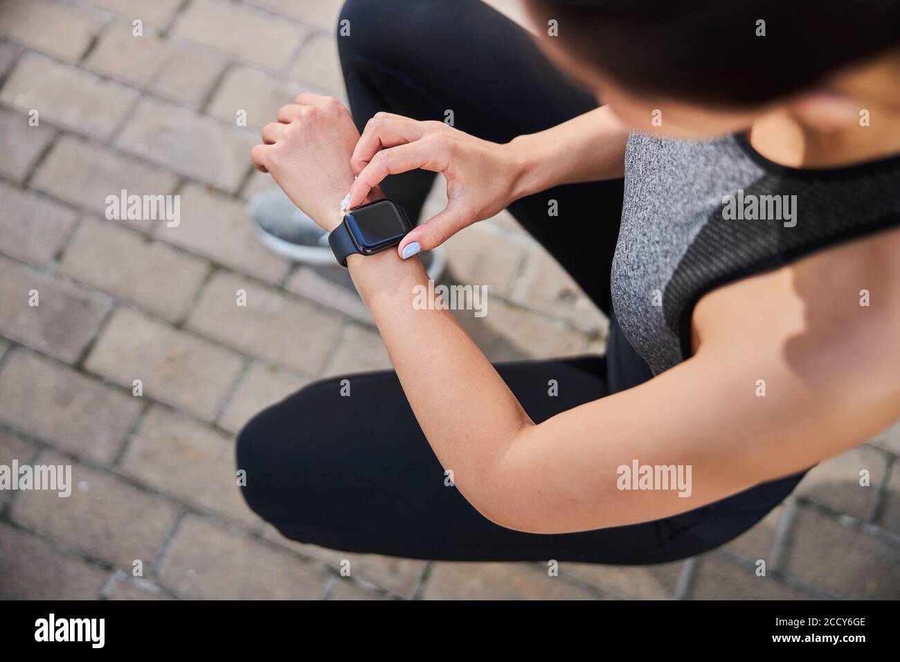 Focused photo on female checking number of steps Stock Photo - Alamy