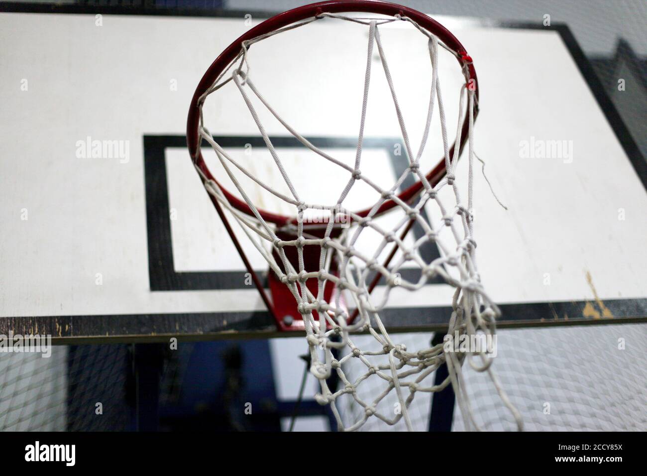 Basketball ring with a net for playing basketball indoors Stock Photo