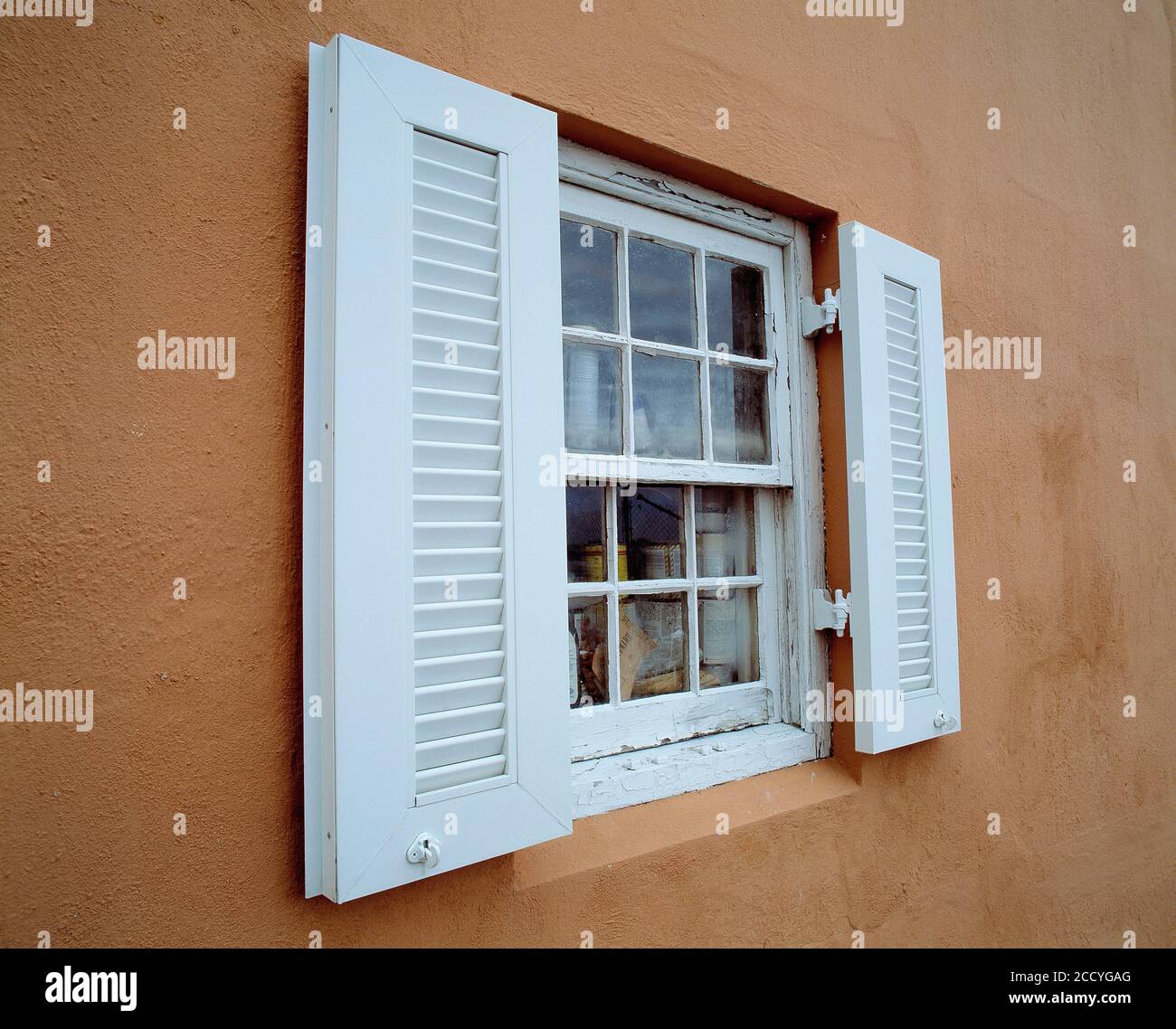 Guernsey. Architecture. Old house. Exterior of sash window with louvred shutters. Stock Photo