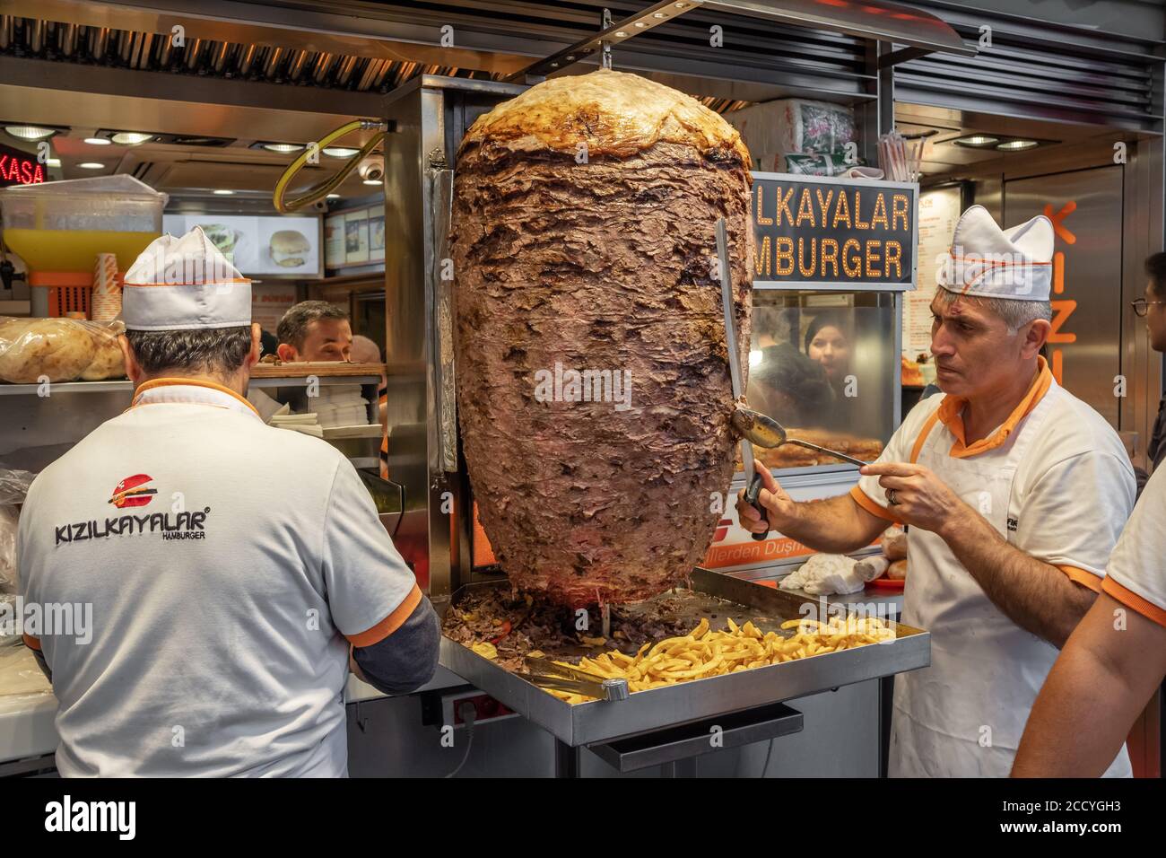 Chef cutting traditional Turkish food Doner Kebab in the restaurant in Istanbul, Turkey. Stock Photo
