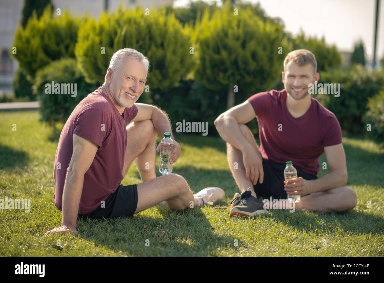 Man drinking water talking on hi-res stock photography and images - Alamy
