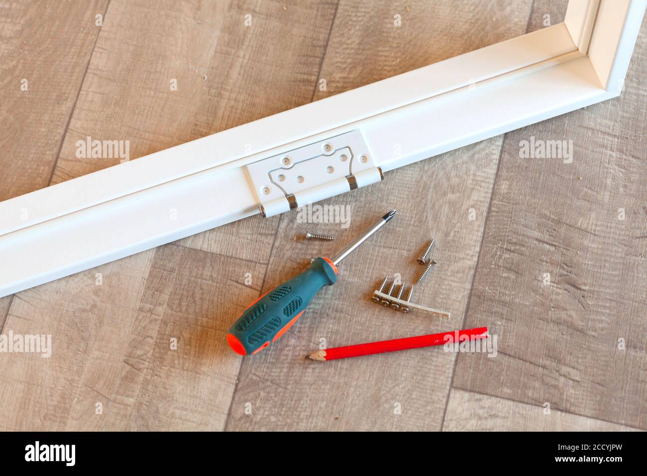 Hinge on the white door frame Stock Photo