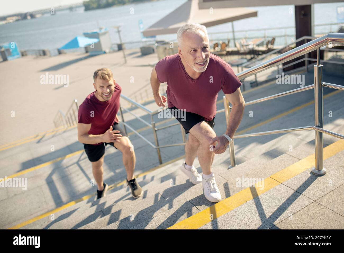 Black man running up stairs hi-res stock photography and images - Alamy