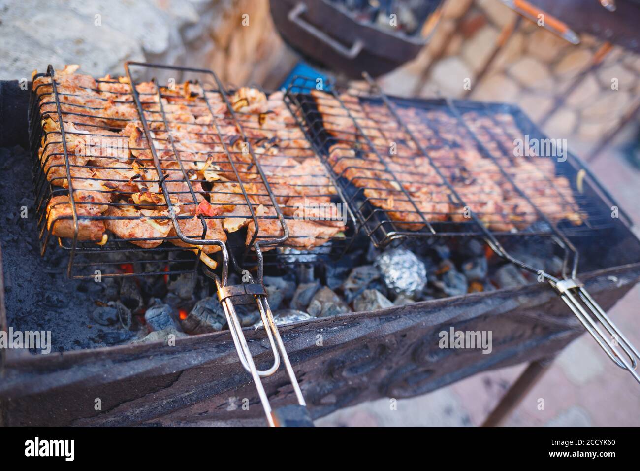 meat is grilled on a charcoal grill Stock Photo - Alamy