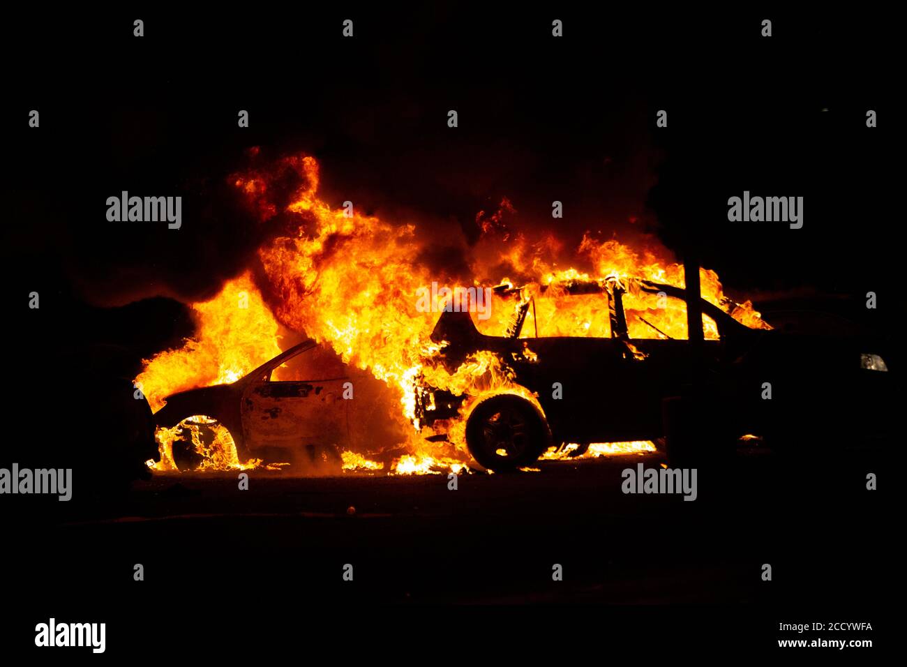 August 24, 2020: Cars burn at a small car dealership. It was set on fire  the previous night with most of the vehicles being destroyed in the fire.  Protesters came back the
