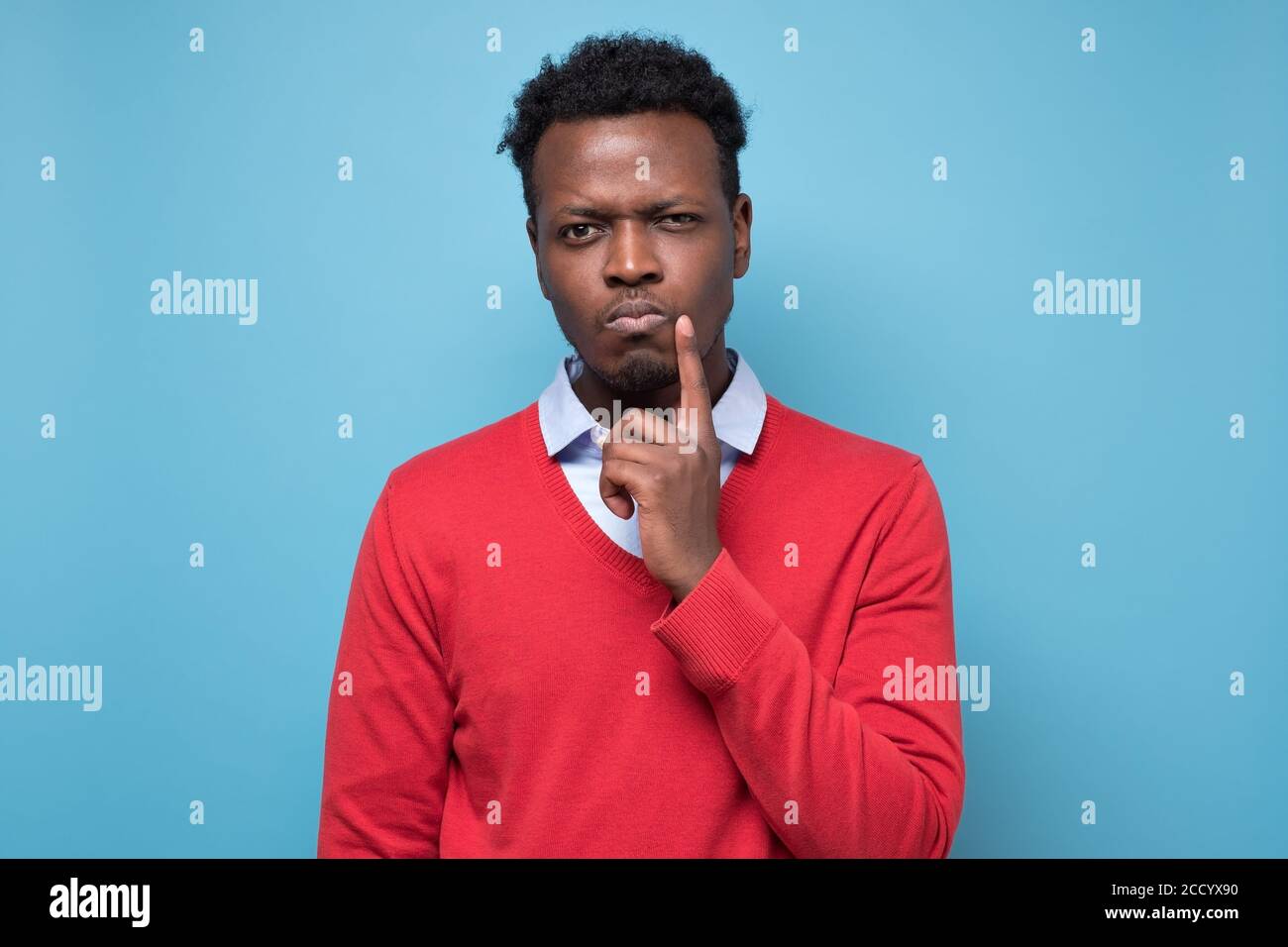 Handsome african man thinking making a plan. Stock Photo