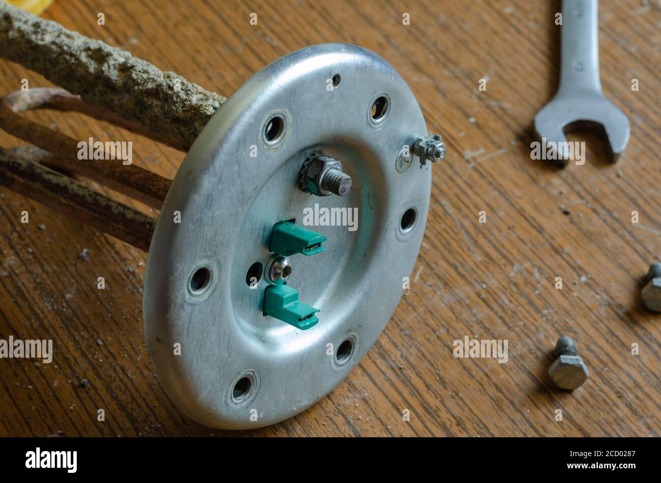Details of a disassembled water heater. Anode, heating element