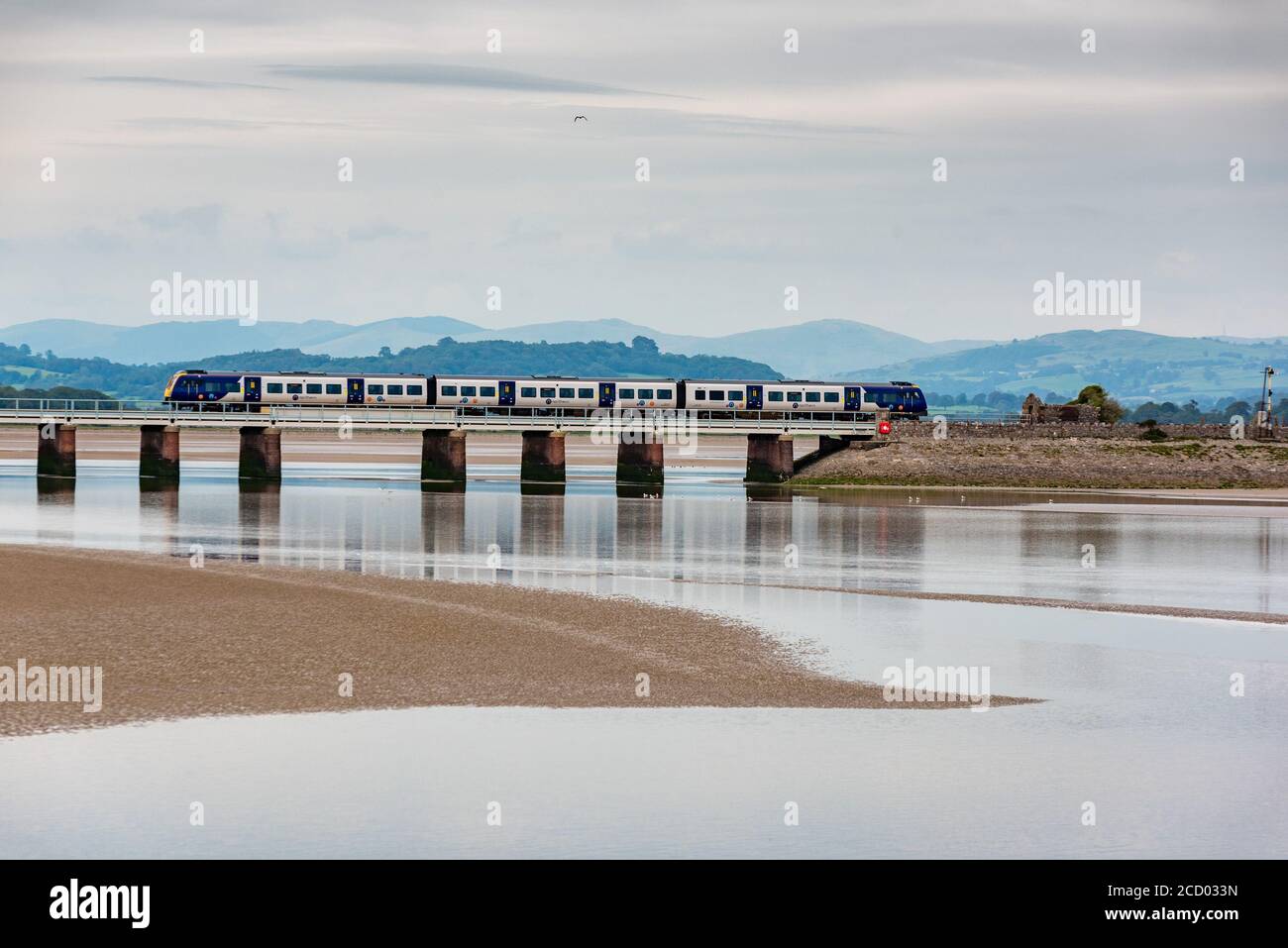 The Lancaster to Barrow-in Furness train crossing the viaduct, Arnside, Cumbria, UK Stock Photo