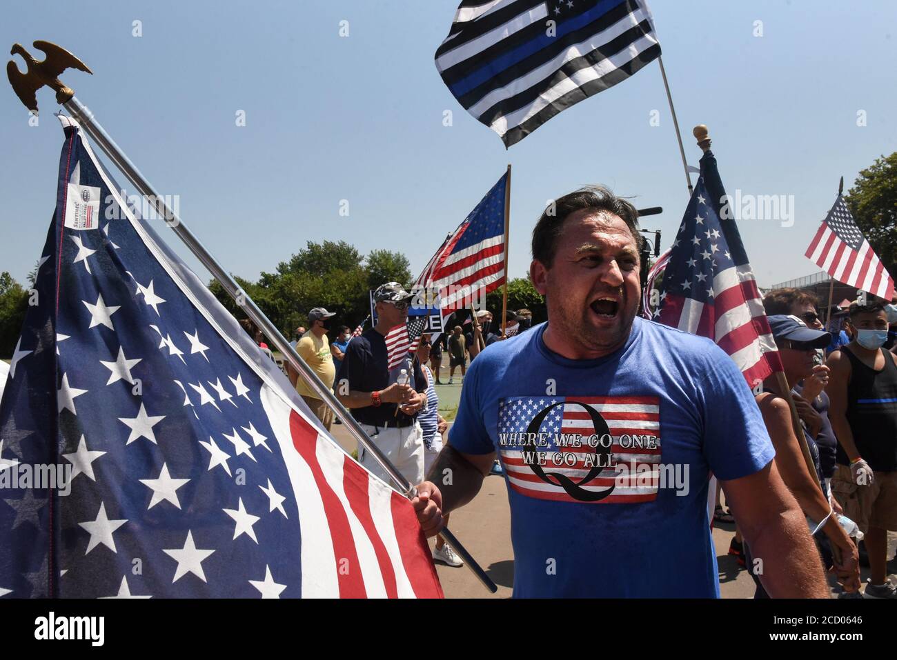 A person wearing a t-shirt supportive of QAnon participates in a 'Back the Blue' rally in the Brooklyn borough of New York City, New York, U.S. August 9, 2020. Picture taken August 9, 2020. REUTERS/Stephanie Keith Stock Photo