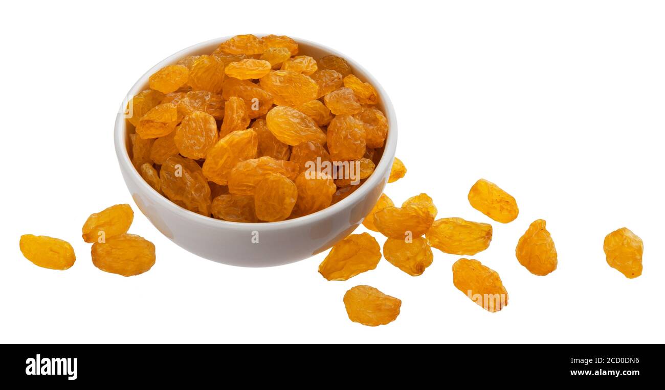 Bowl of golden raisins isolated on white background Stock Photo