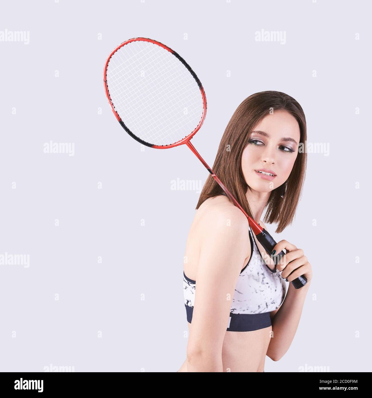 Beauty sport girl. Pretty young woman in fitness clothes. Slim body.  Badminton Stock Photo - Alamy