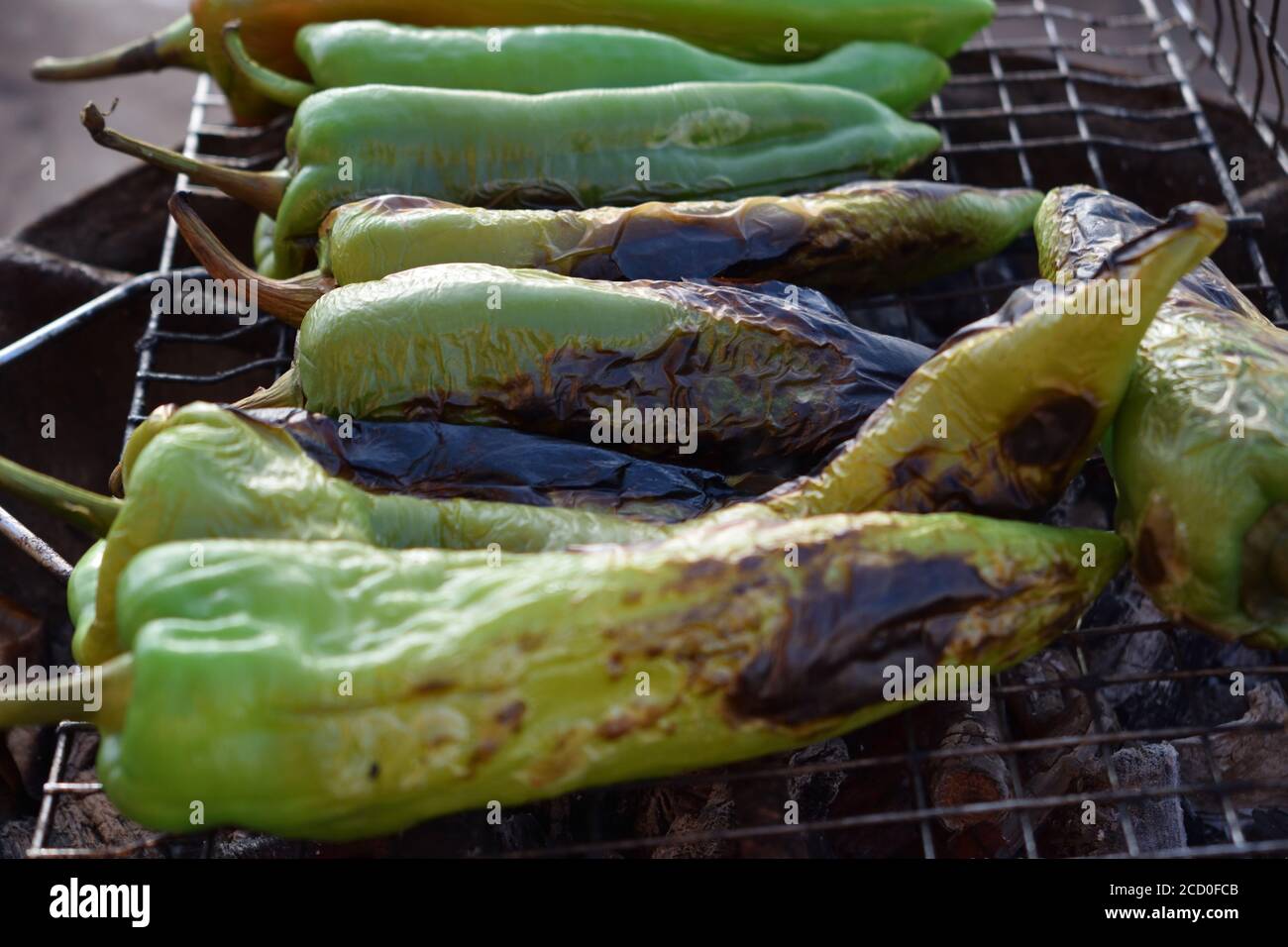 green peppers grilling on the barbecue for healthy lifestyle eating Stock Photo