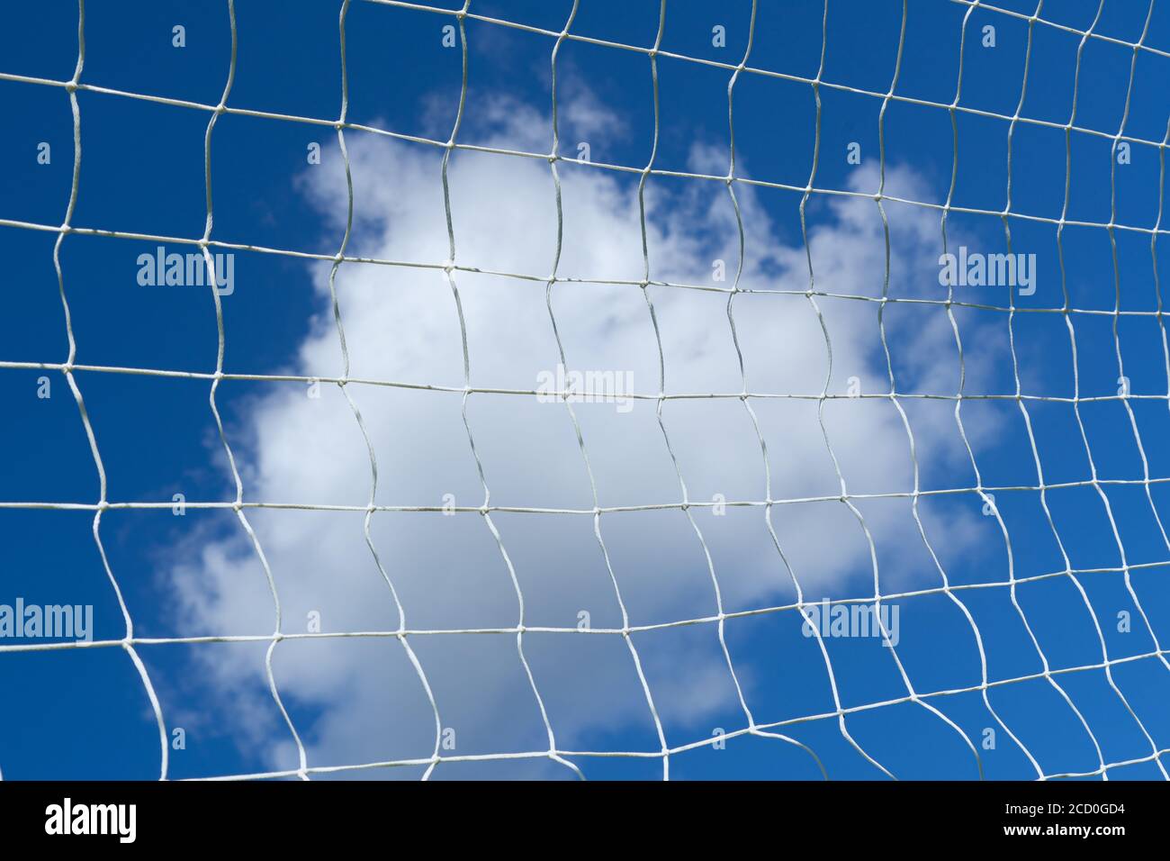 Soccer football net with blue sky and white clouds background Stock