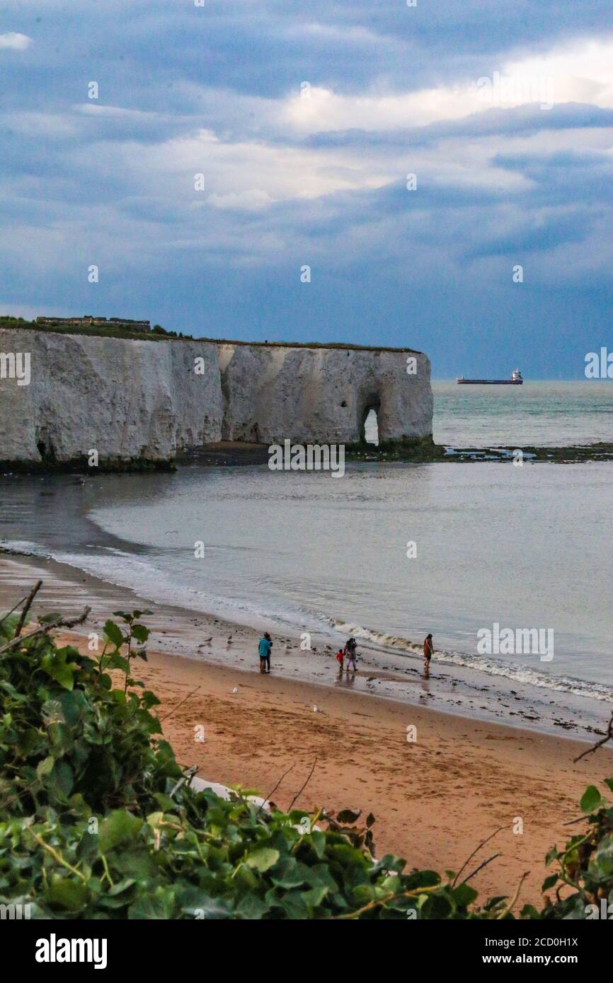 Beautiful Kingsgate Beach at sunset, showing the rock arch, near Broadstairs, Kent, South East England Stock Photo