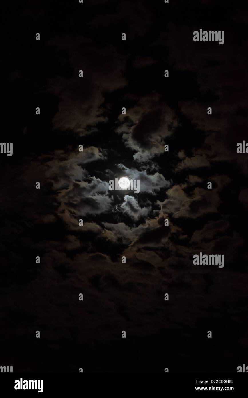 Full moon in the night sky with clouds Stock Photo - Alamy