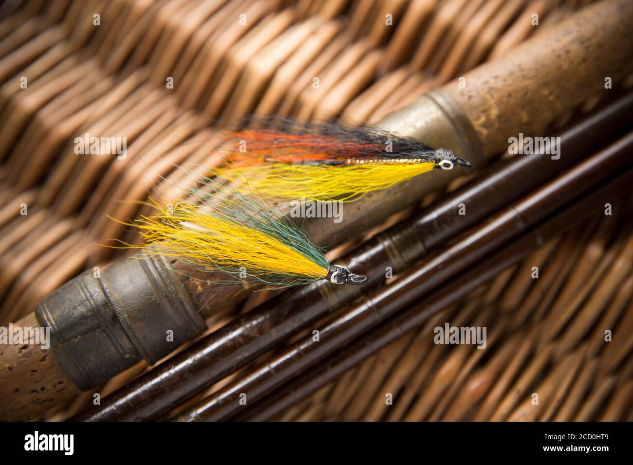 Two salmon flies that were probably homemade on an old wooden salmon fly  fishing rod. From a collection of vintage fishing tackle. Desaturated  colours Stock Photo - Alamy