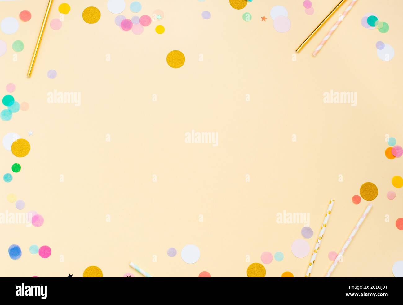 Frame of colored confetti on light yellow background with blank space for  text. Top view, flat lay Stock Photo - Alamy