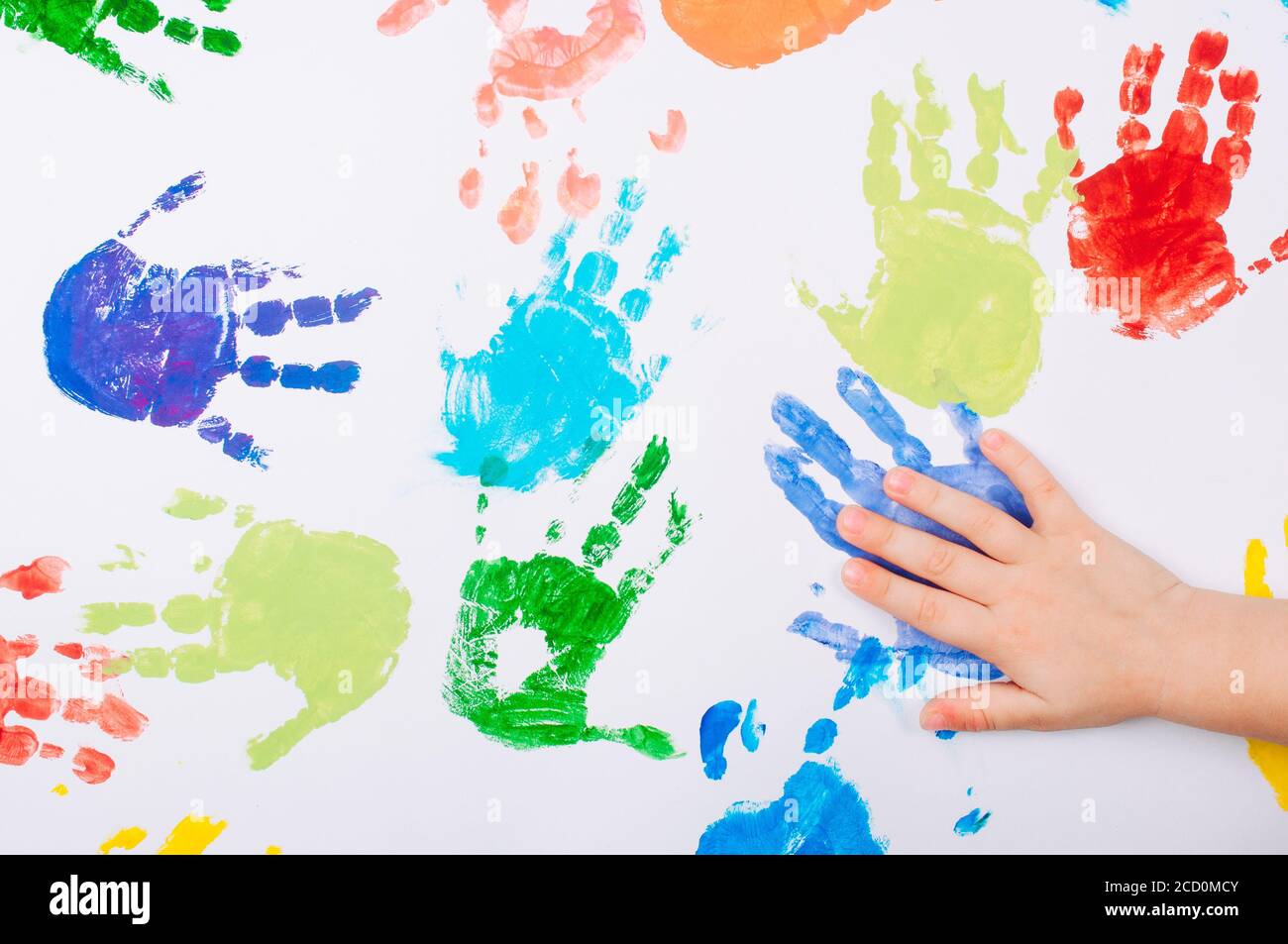 Children making handprints with paint hires stock photography and