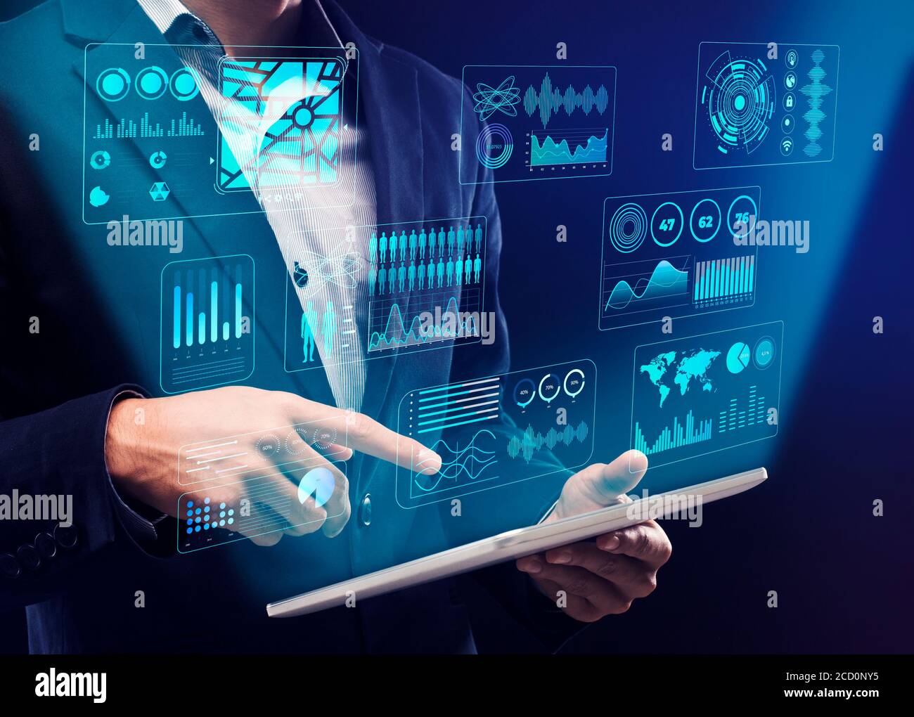 Businessman using digital tablet with interactive board Stock Photo