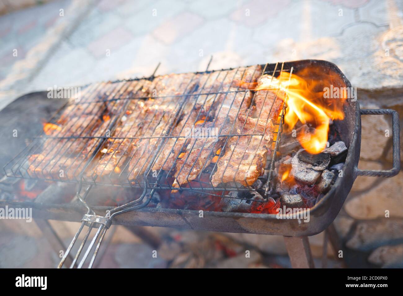 meat is grilled on a charcoal grill Stock Photo - Alamy