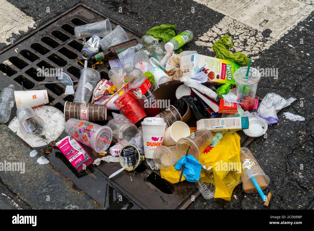 A clogged storm drain, filled with garbage, in the Chelsea neighborhood of New York on Sunday, August 16, 2020. (© Richard b. Levine) Stock Photo
