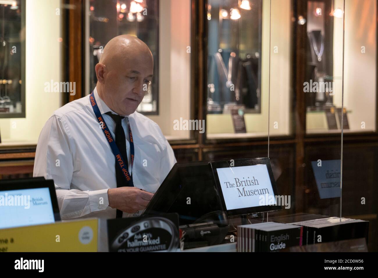 London England. 25th August 2020. A shop assistant at the The British Museum shop. The British Museum will reopen it s doors to the public in line with government guidelines and with new