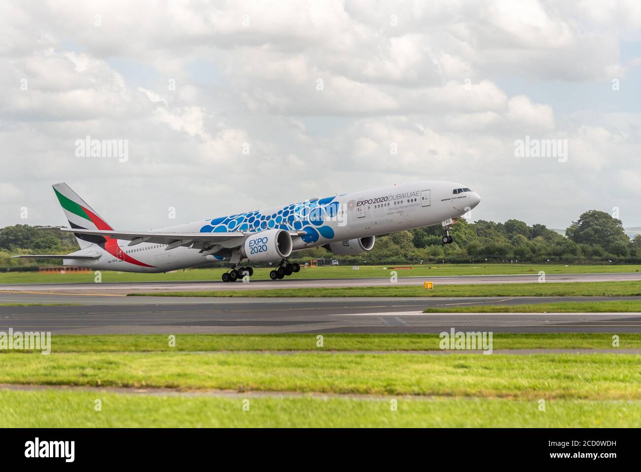MANCHESTER UK, AUGUST 20 2020: Emirates airlines Boeing 777-31H(ER) flight EK18 to Dubai, UAE, is documented taking off from runway 23R. Stock Photo
