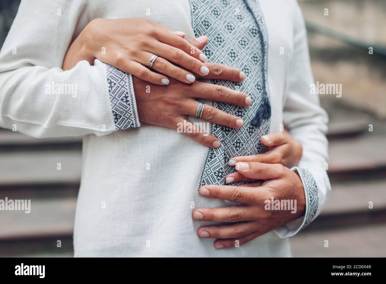 Couple wearing wedding rings best sale