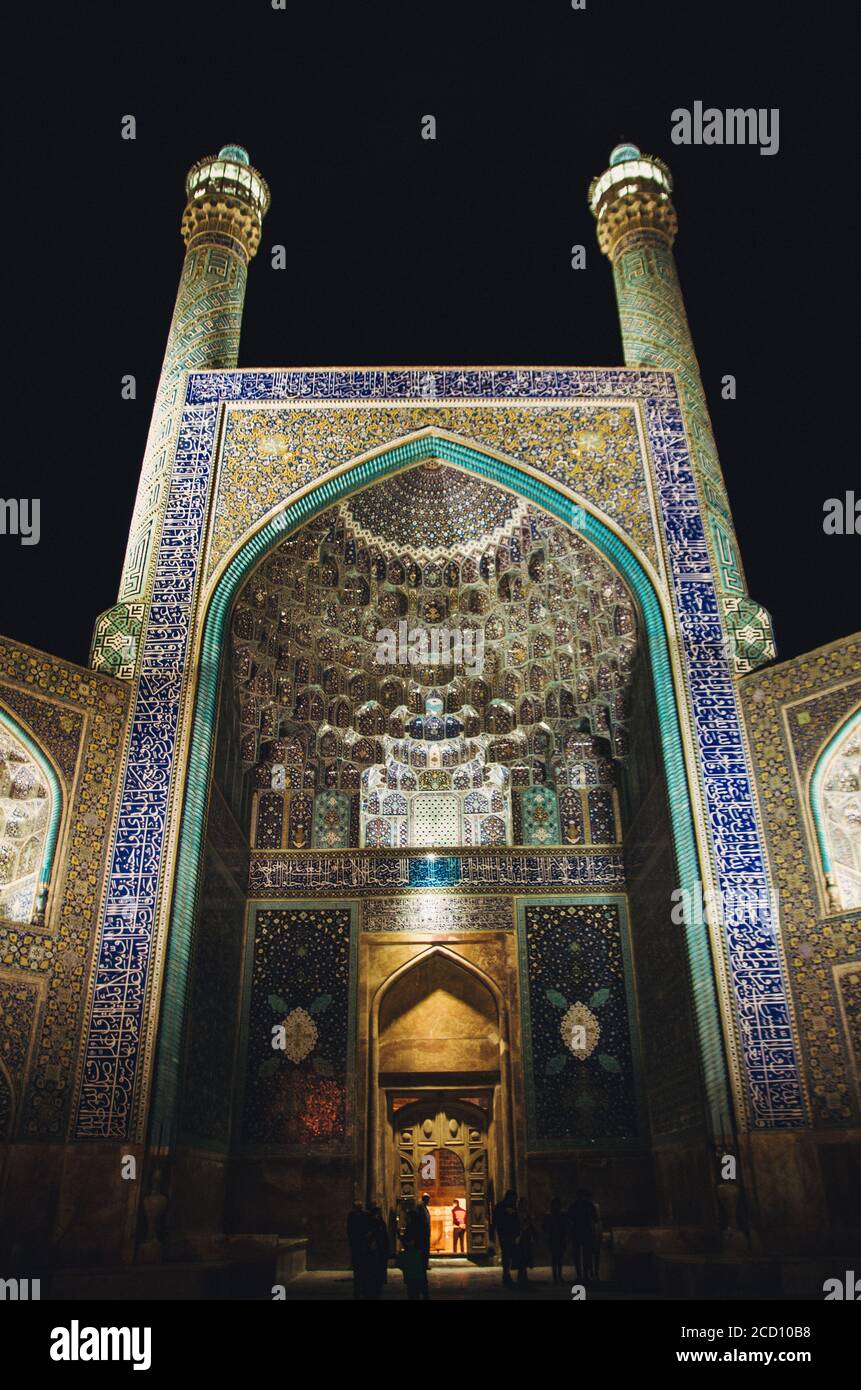 Illuminated mosque in Iran city of Esfahan at night with ornamented traditional tiles at night Stock Photo