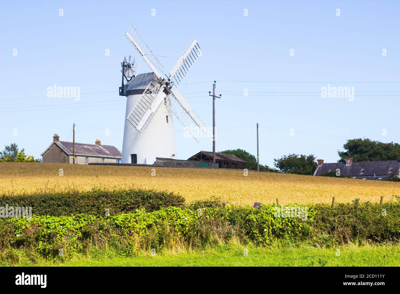 The traditional Ballycopeland Windmill on a bright summers day. This historic stone built tower is a local landmark outside of Millisle County Down No Stock Photo