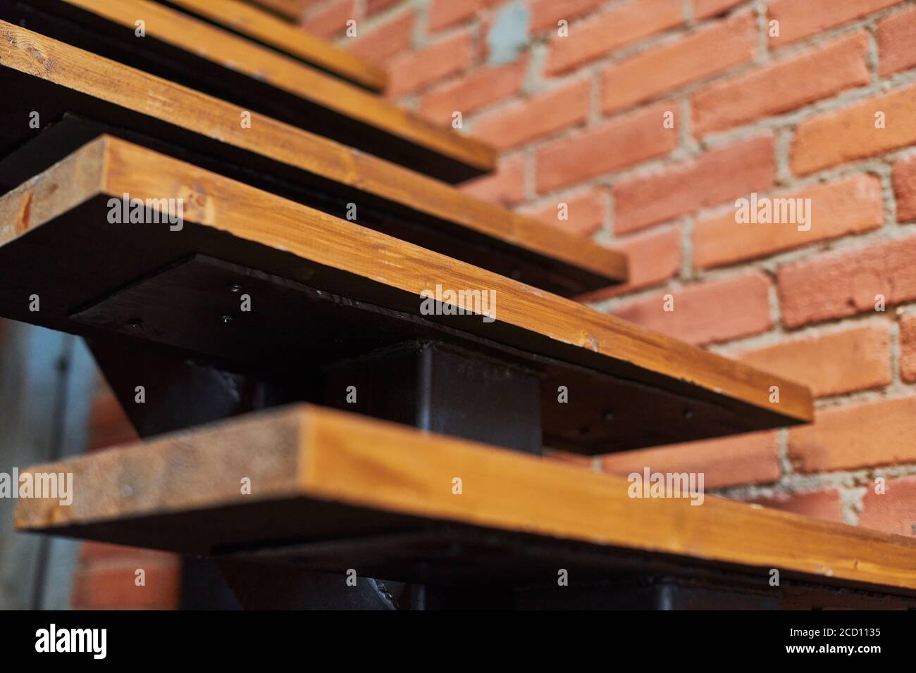 Stairs in loft apartment. Staircase without railing. Modern hipster ...
