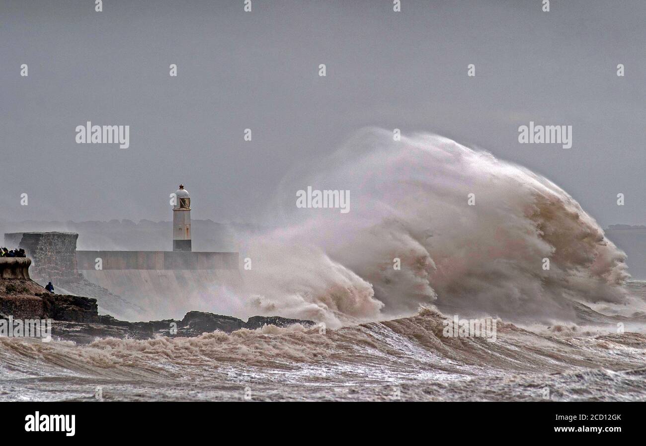Porthcawl, South Wales, UK. 25th Aug, 2020. Huge waves crash over the harbour wall and lighthouse at Porthcawl in South Wales this morning as Storm Francis unleashes itself on the UK. Credit: Phil Rees/Alamy Live News Stock Photo