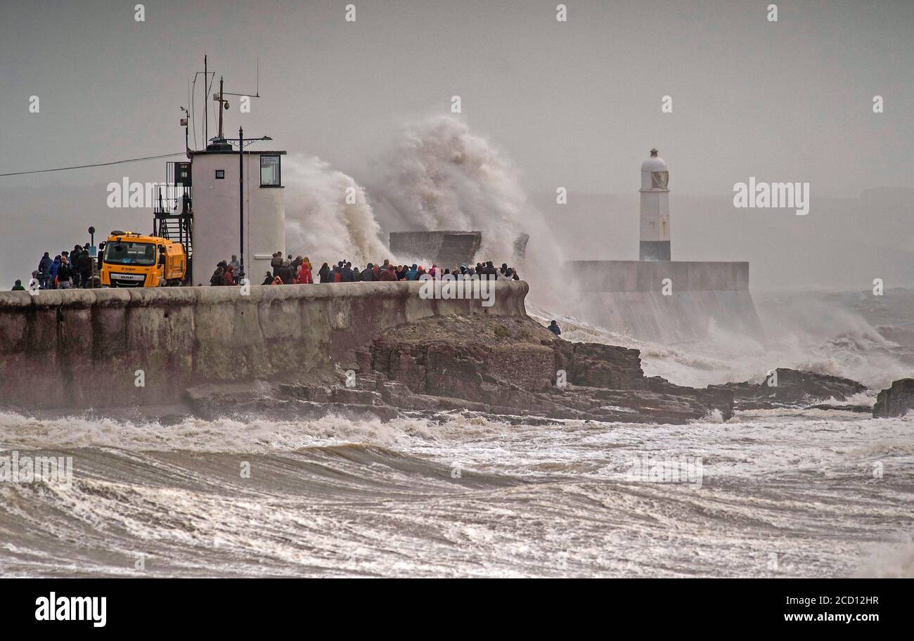 Porthcawl, South Wales, UK. 25th Aug, 2020. Huge waves crash over the harbour wall and lighthouse at Porthcawl in South Wales this morning as Storm Francis unleashes itself on the UK. Credit: Phil Rees/Alamy Live News Stock Photo