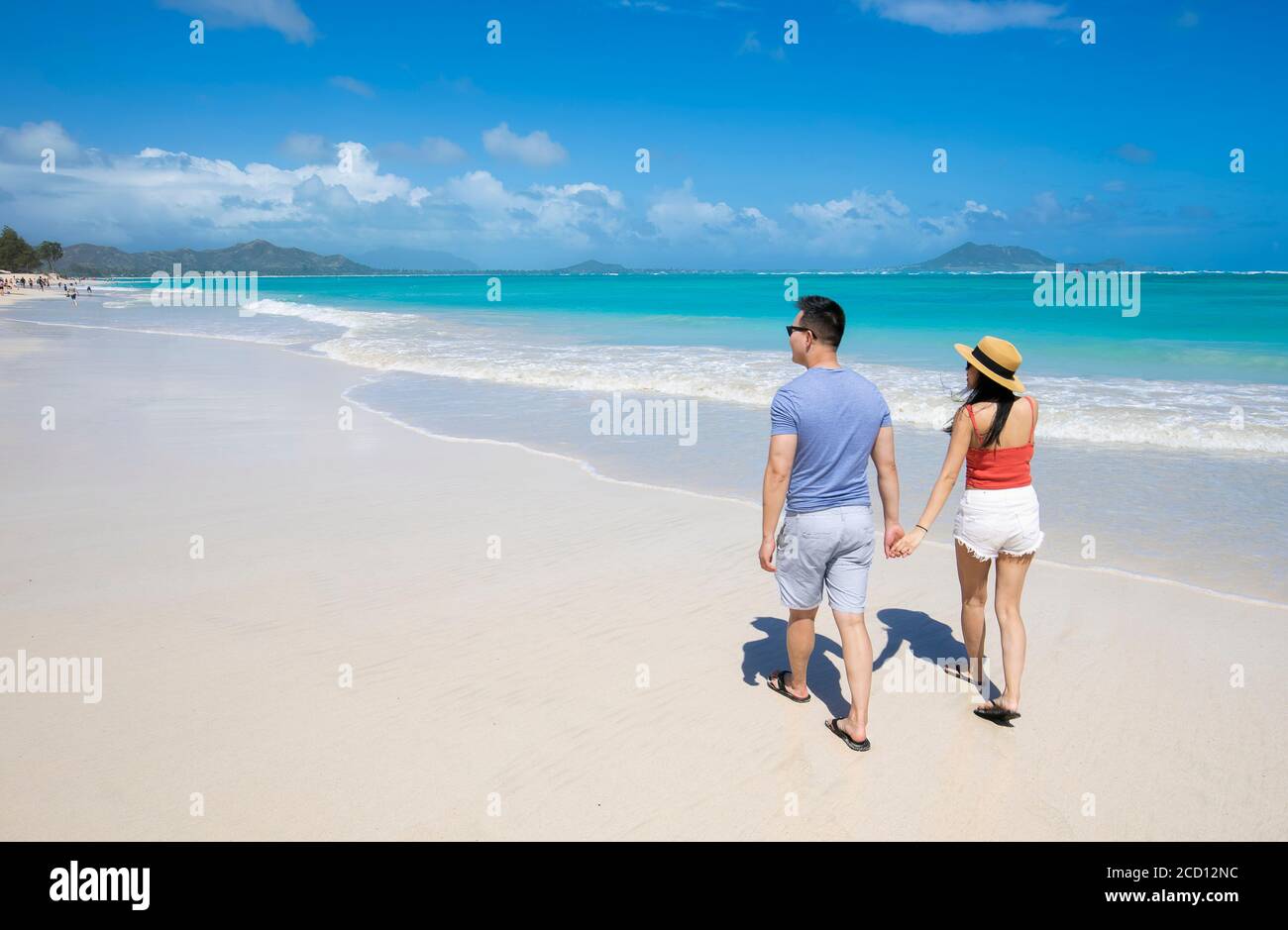 An Asian couple enjoying a vacation at Kailua Beach Park: Kailua, Oahu, Hawaii, United States of America Stock Photo