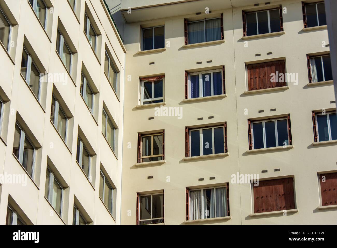 Real estate / housing market: exterior view of residential buildings with many apartment windows Stock Photo