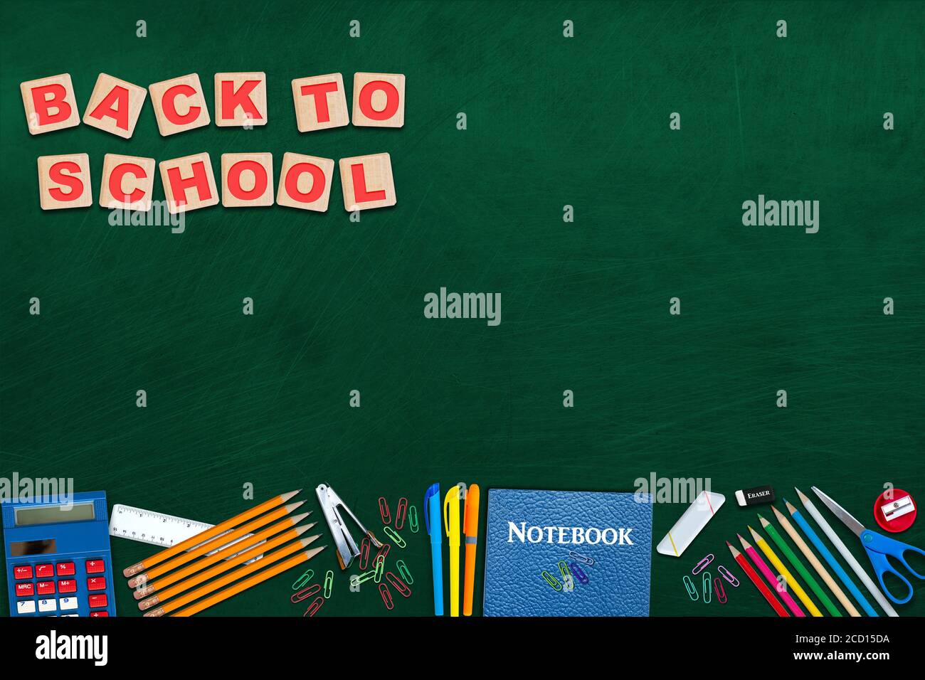 Back to school on alphabet blocks, concept of education with stationery on chalkboard. and copy space. Stock Photo