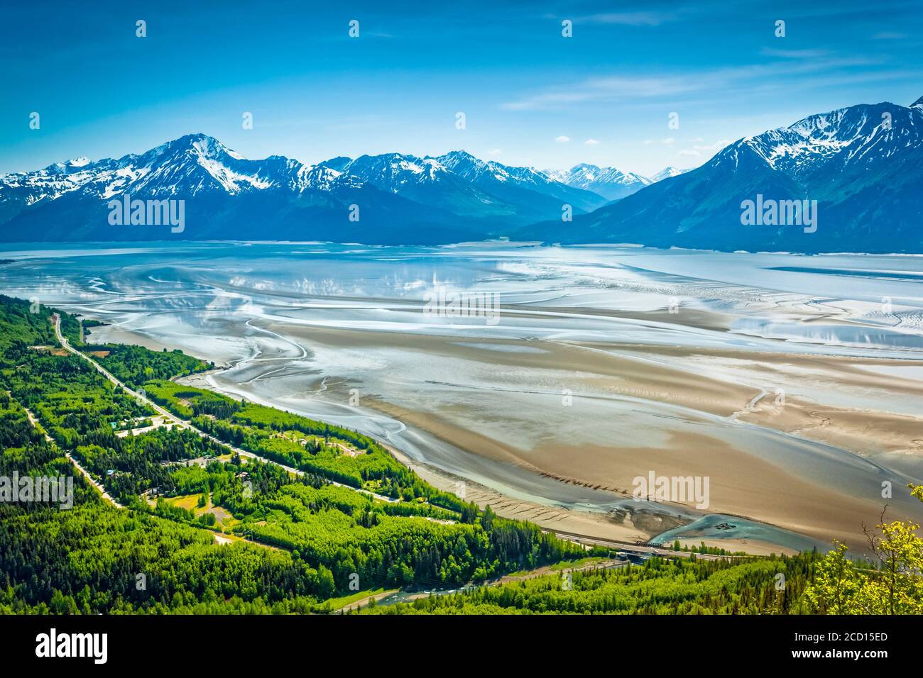 Turnagain Arm of Cook Inlet under blue sky, Chugach State Park, South-central Alaska in summertime; Alaska, United States of America Stock Photo