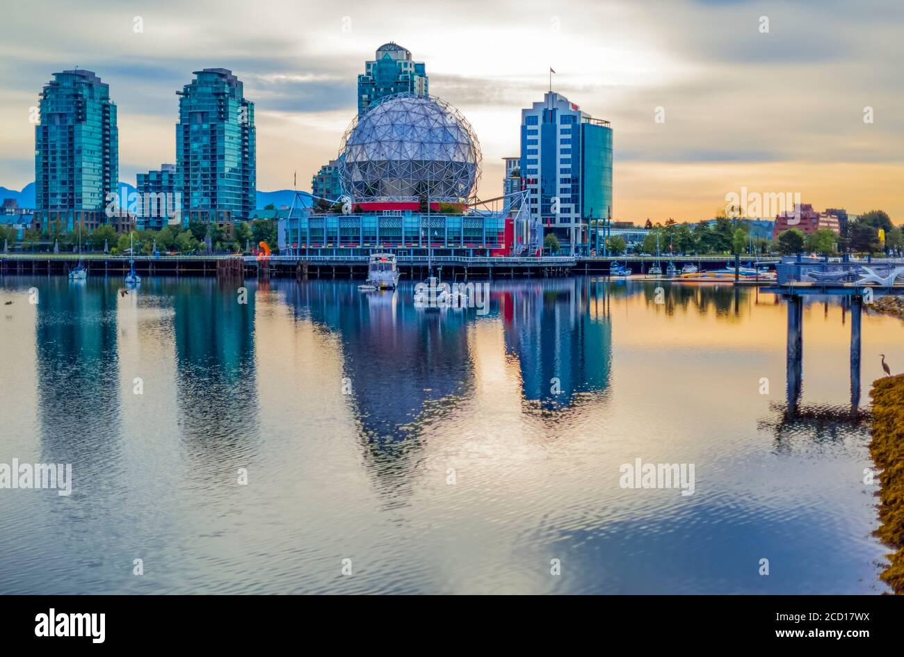 Science World and residential and commercial buildings at sunset along the Vancouver waterfront, False Creek; Vancouver, British Columbia, Canada Stock Photo