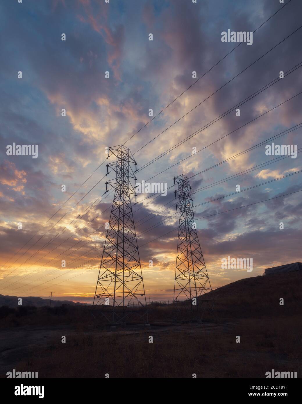Low angle shot of electricity wires under a beautiful sunset sky Stock ...