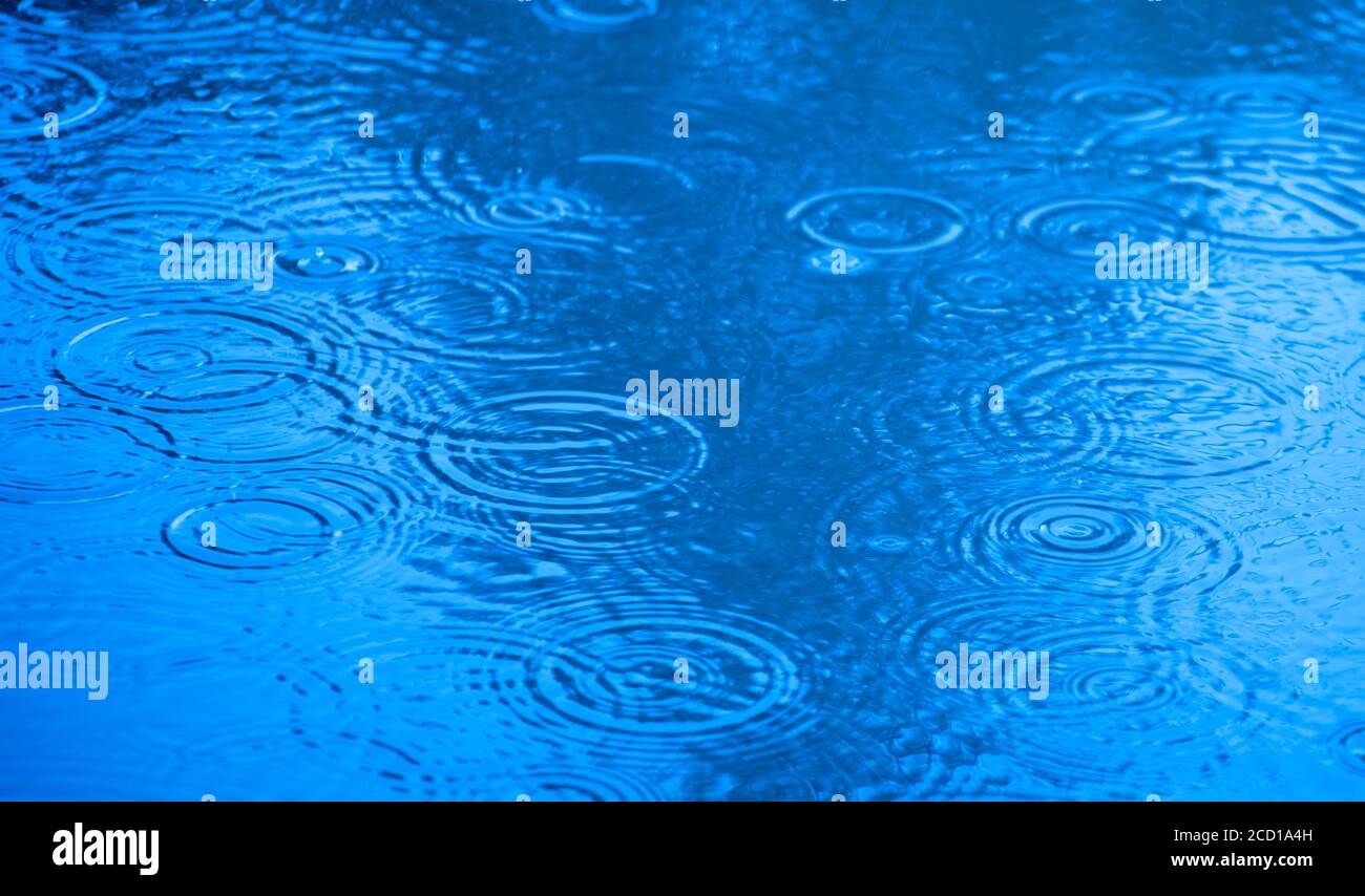Close up raindrops falling puddle hi-res stock photography and images ...