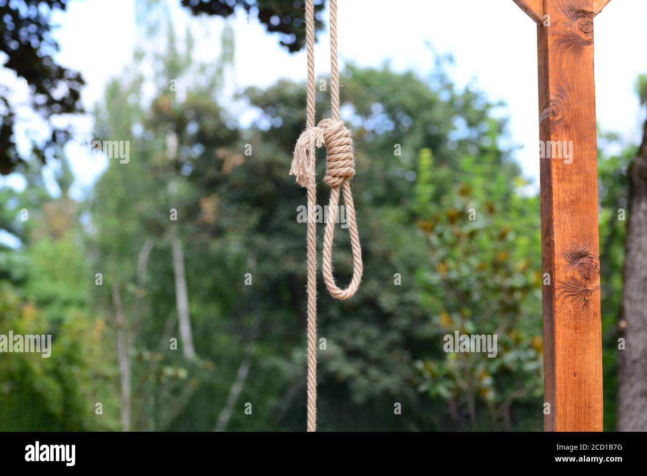 Gallows hanging rope knot tied noose outdoors Stock Photo